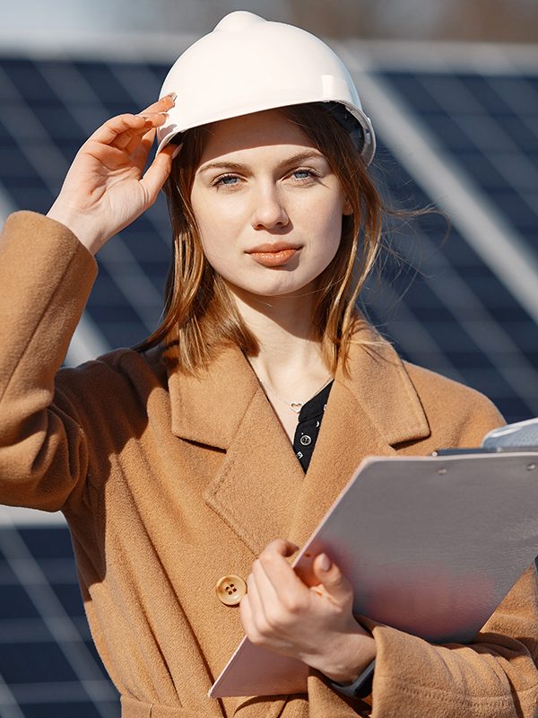 Businesswomen working on checking equipment at solar power plant. With tablet checklist, woman working on outdoor at solar power.